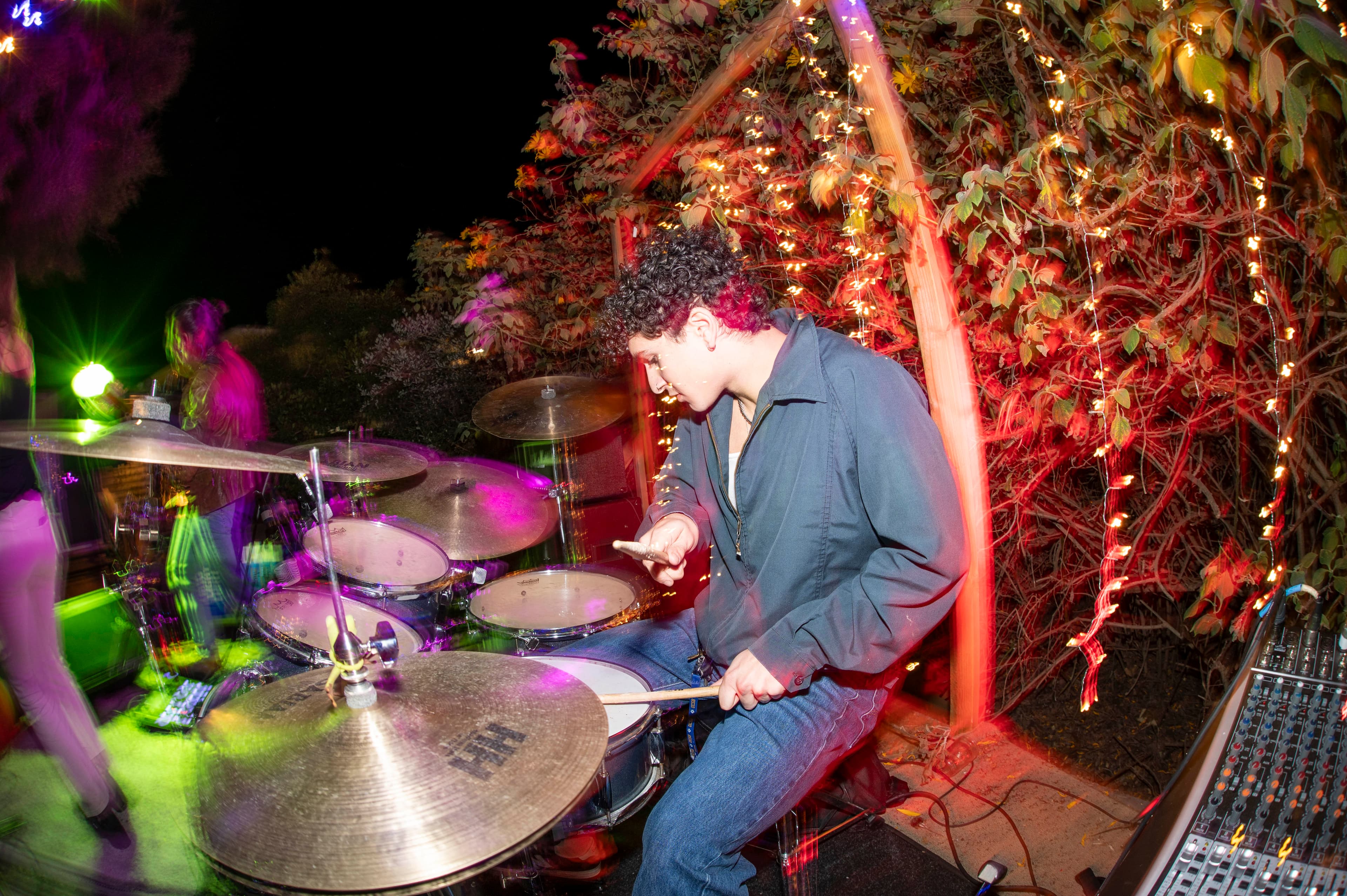 Ryan playing drums live at an outdoor performance